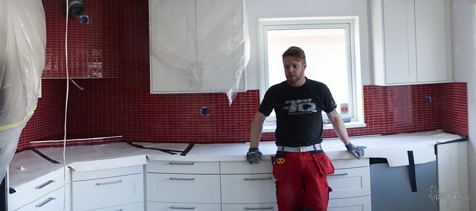 Finished kitchen with red mosaic tiles