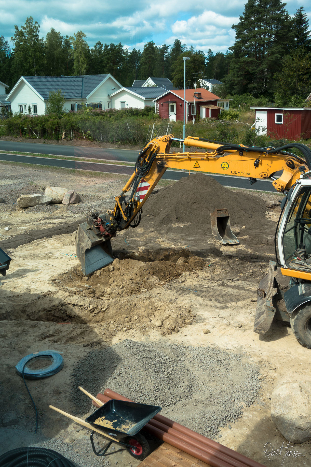 Excavator digging the hole for the trampoline